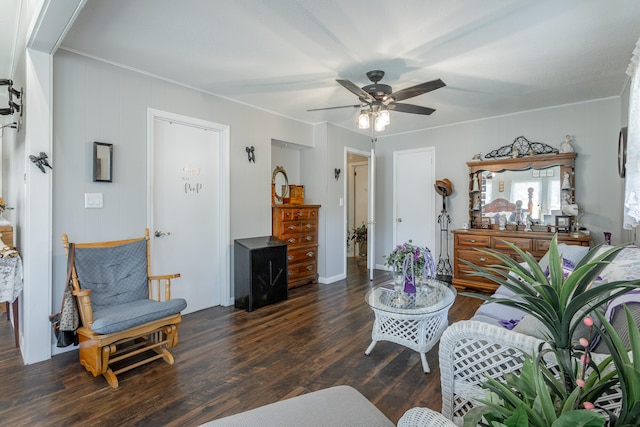 living room featuring ceiling fan and dark hardwood / wood-style floors