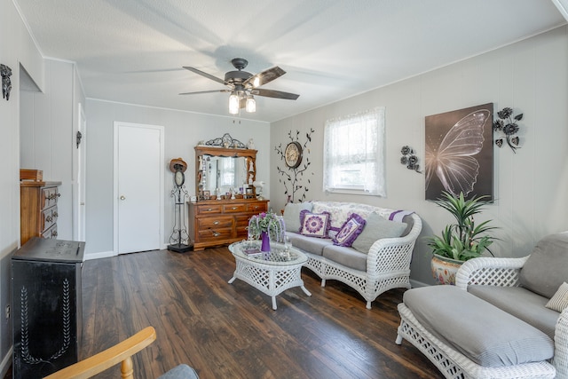 living room with ceiling fan, dark hardwood / wood-style floors, and crown molding