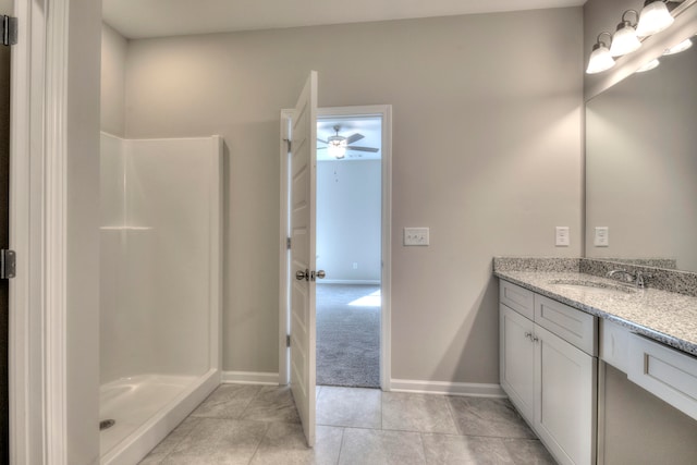 bathroom with vanity, tile patterned floors, and walk in shower