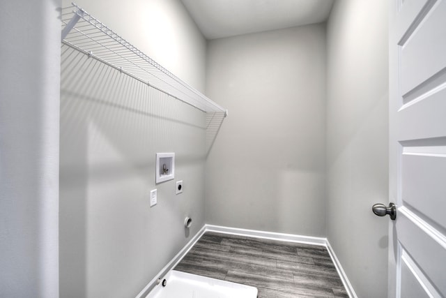 laundry room featuring hookup for an electric dryer, dark hardwood / wood-style floors, and washer hookup