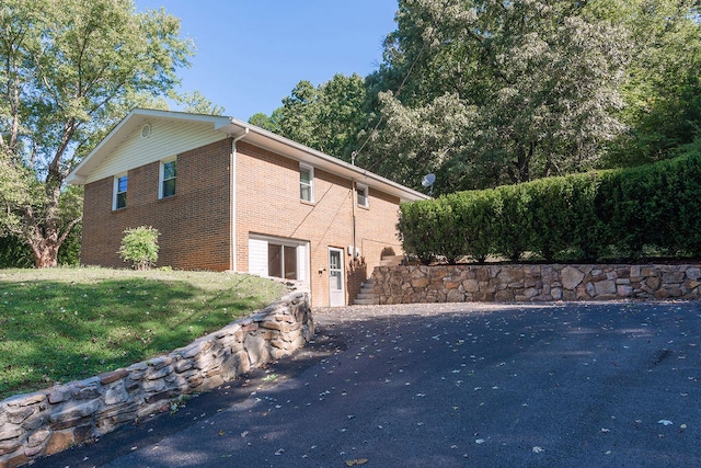 view of home's exterior with a yard