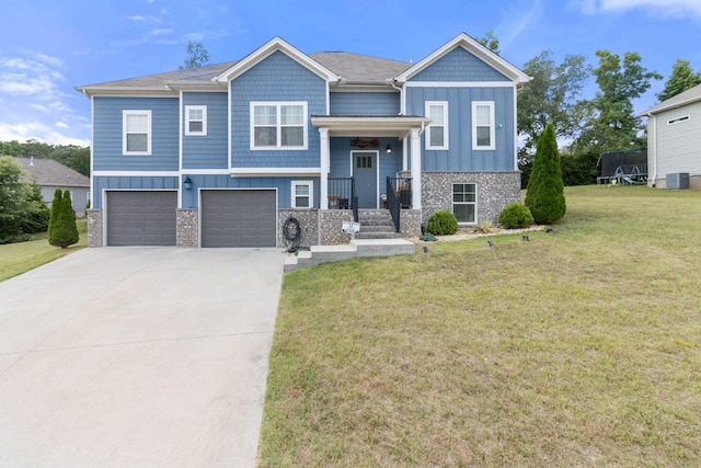 view of front of property featuring a garage and a front yard