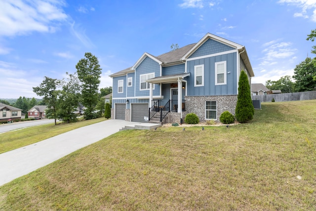 split foyer home featuring a front lawn and a garage