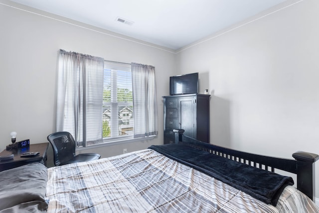 bedroom featuring ornamental molding