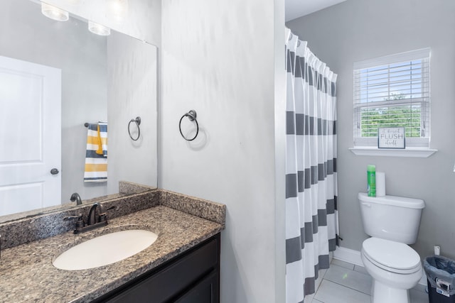 bathroom with a shower with shower curtain, vanity, toilet, and tile patterned floors