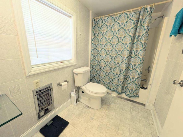 bathroom featuring curtained shower, tile walls, toilet, and heating unit