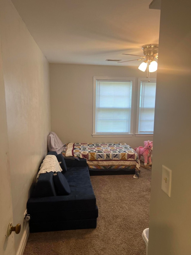 bedroom featuring ceiling fan and carpet floors