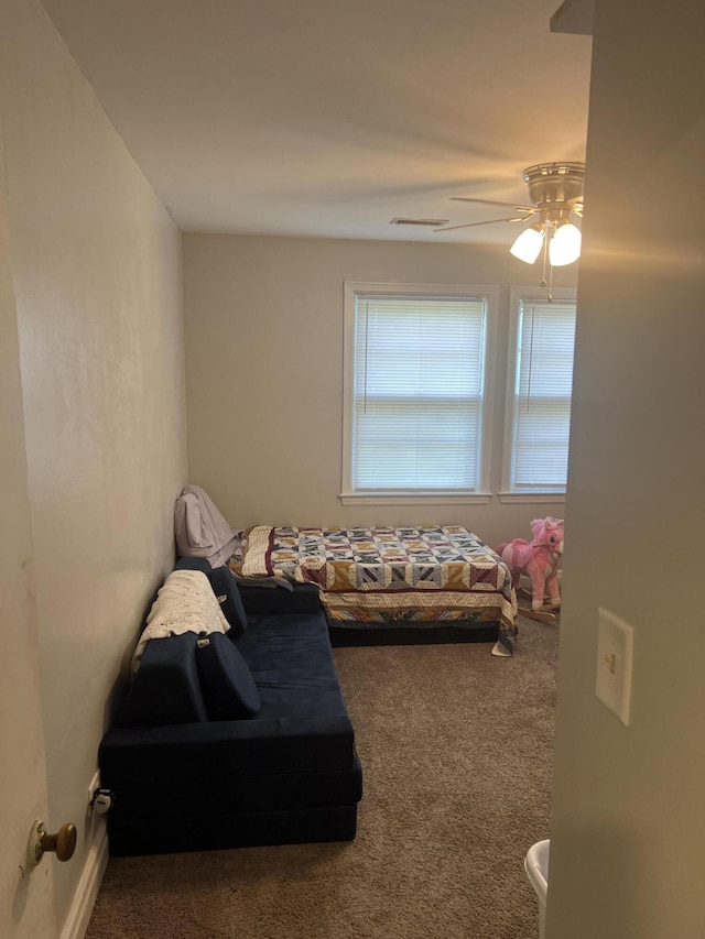 carpeted bedroom with a ceiling fan