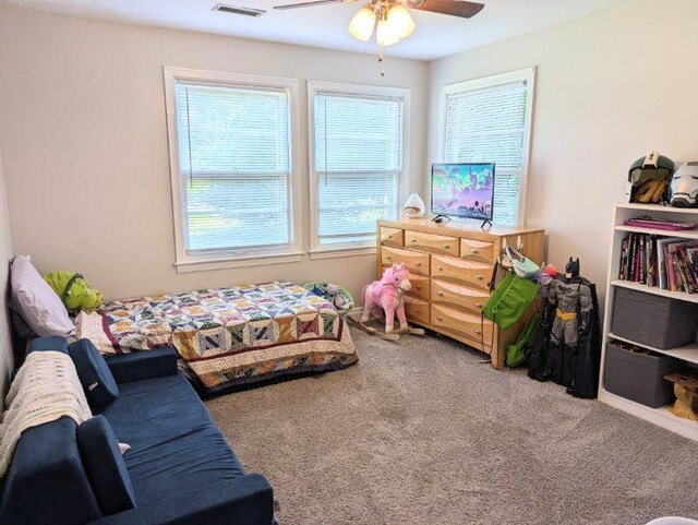 bedroom featuring ceiling fan and carpet floors