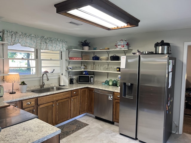 kitchen featuring open shelves, marble finish floor, a sink, visible vents, and appliances with stainless steel finishes