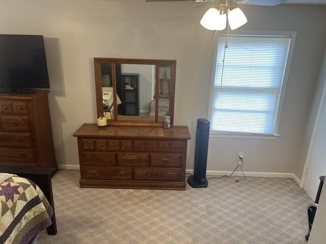 bedroom featuring ceiling fan and carpet floors