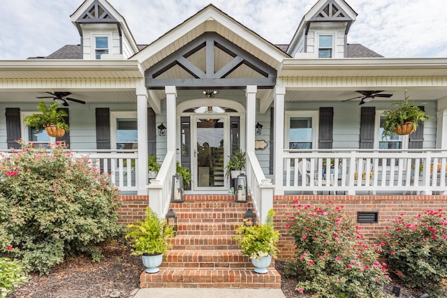 entrance to property with ceiling fan and covered porch