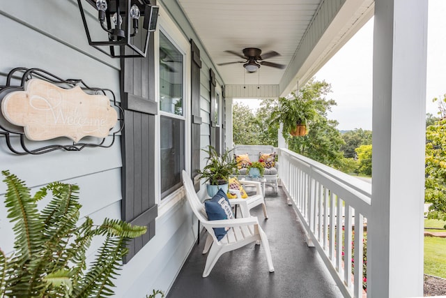 balcony with covered porch and ceiling fan