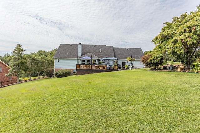 view of yard with a wooden deck