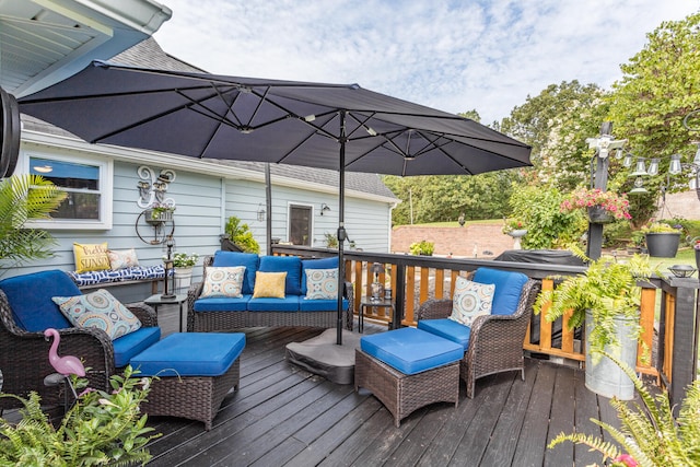 wooden terrace with outdoor lounge area