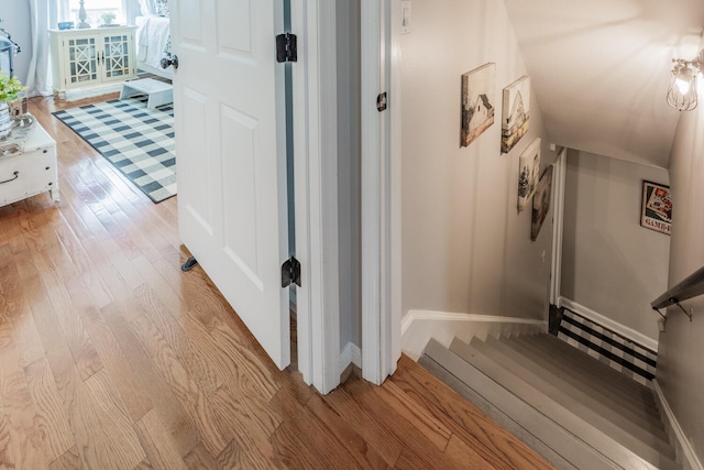 hall with hardwood / wood-style floors