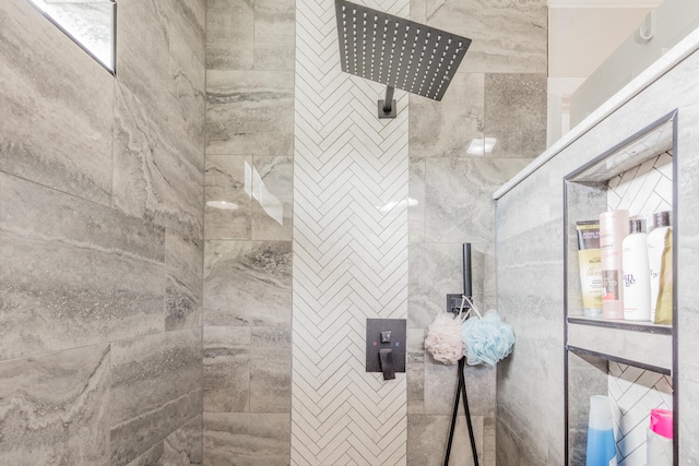 bathroom with a tile shower