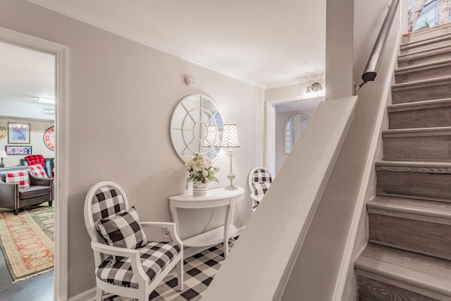 staircase featuring crown molding