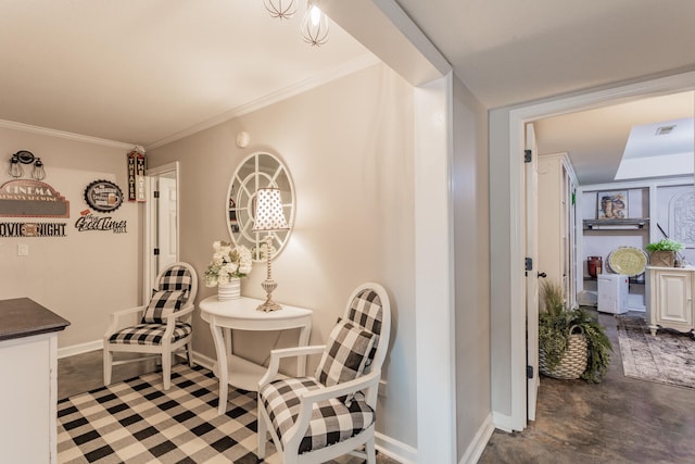 dining room with concrete flooring and crown molding