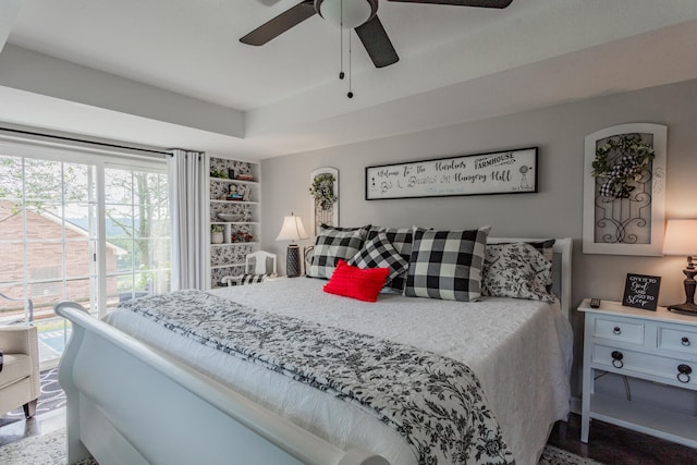 bedroom with ceiling fan and multiple windows