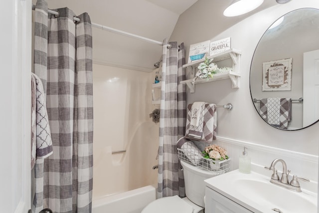 full bathroom with vanity, toilet, vaulted ceiling, and shower / bathtub combination with curtain