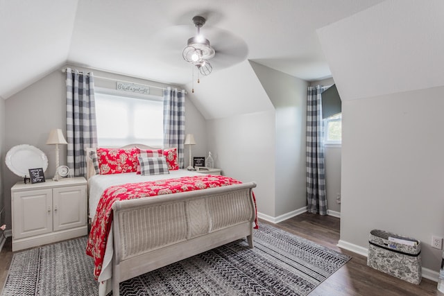 bedroom with lofted ceiling, dark wood-type flooring, and ceiling fan