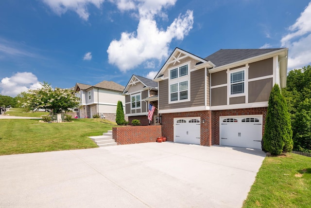 view of front of home with a front yard and a garage