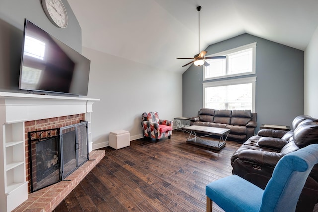 living room with lofted ceiling, dark wood-type flooring, ceiling fan, and a fireplace