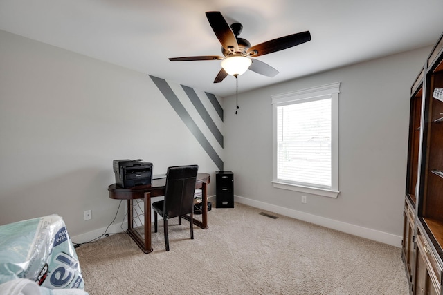 office with ceiling fan and light colored carpet