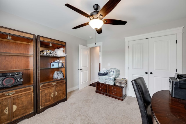 office with ceiling fan and light colored carpet