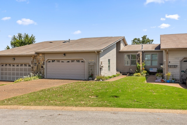 ranch-style house with a garage and a front yard