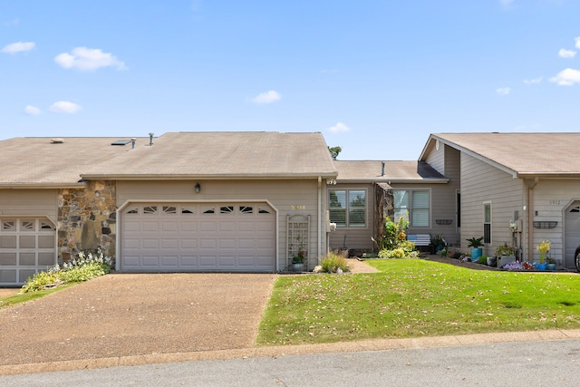 single story home with a garage and a front yard