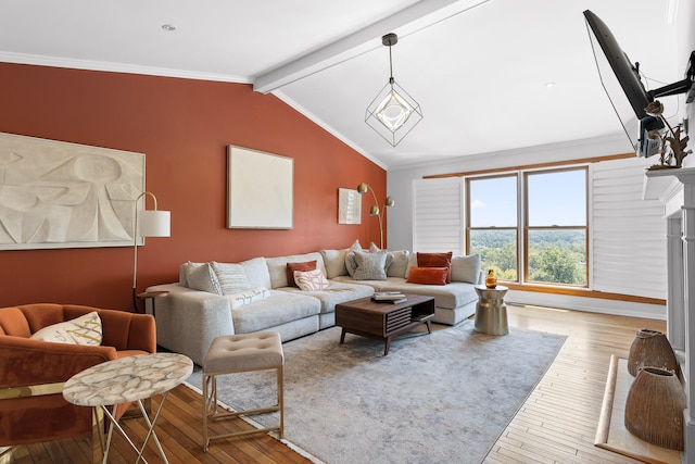 living room featuring crown molding, vaulted ceiling with beams, and light hardwood / wood-style floors