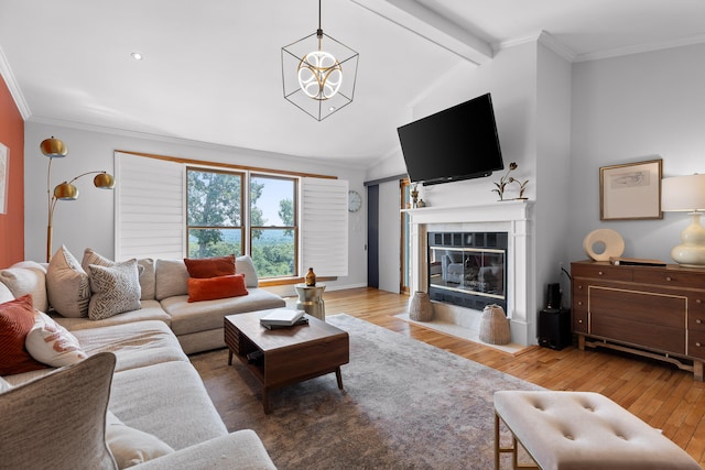 living room featuring hardwood / wood-style floors, an inviting chandelier, crown molding, and lofted ceiling with beams