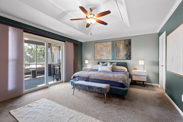 carpeted bedroom featuring ceiling fan, a raised ceiling, access to exterior, and crown molding