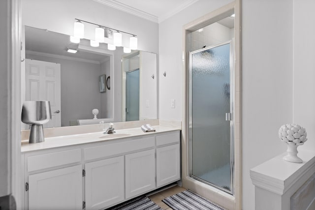 bathroom with crown molding, vanity, an enclosed shower, and tile patterned flooring