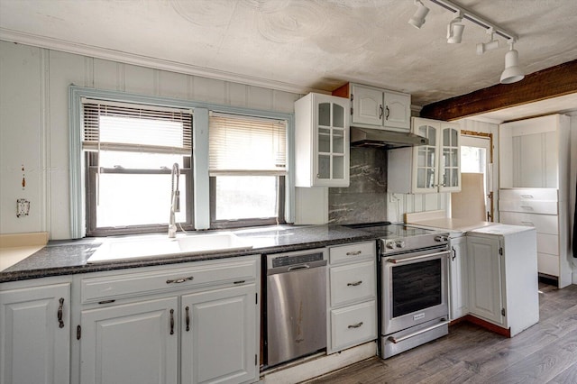 kitchen with dark hardwood / wood-style floors, beamed ceiling, stainless steel appliances, sink, and white cabinets