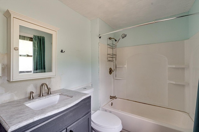 full bathroom with vanity, toilet, a textured ceiling, and  shower combination