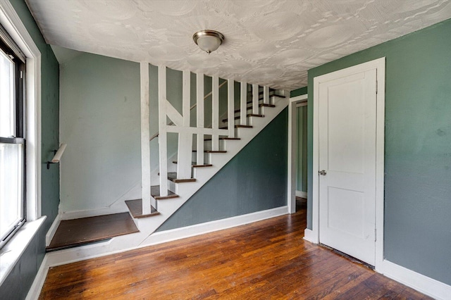 interior space featuring a wealth of natural light and hardwood / wood-style floors