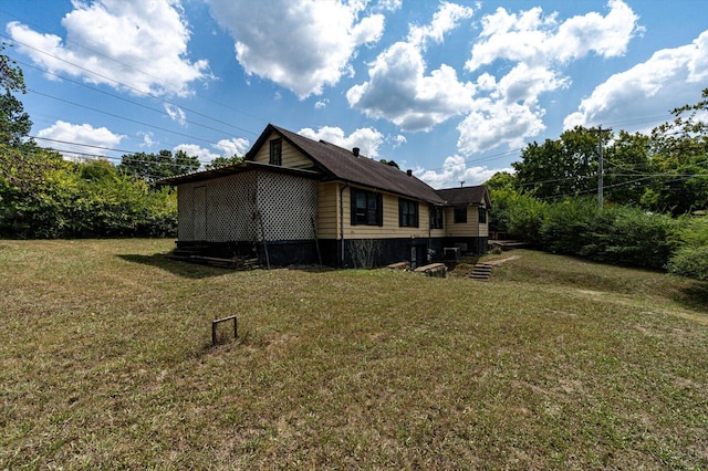 view of property exterior with a lawn