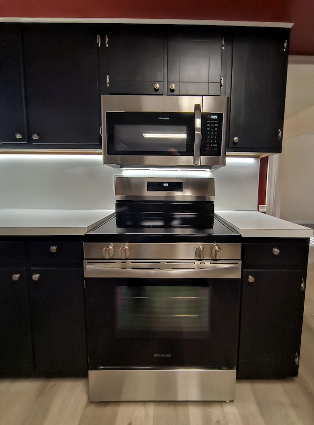 kitchen featuring stainless steel appliances and light wood-type flooring