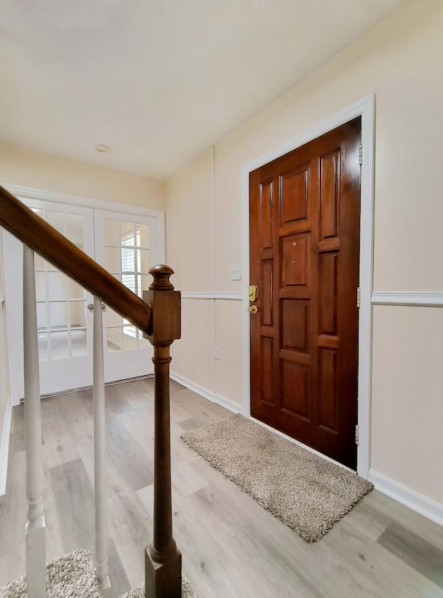 foyer with light hardwood / wood-style floors