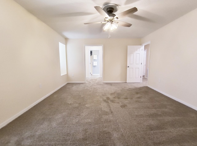 carpeted empty room featuring ceiling fan