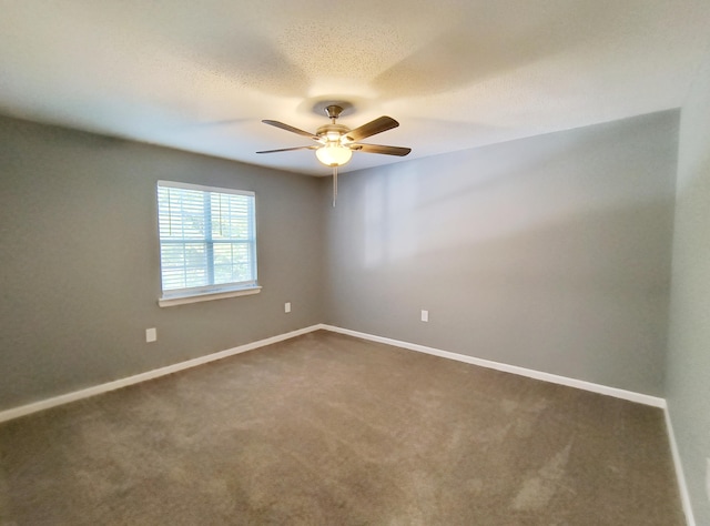 spare room with ceiling fan and carpet flooring