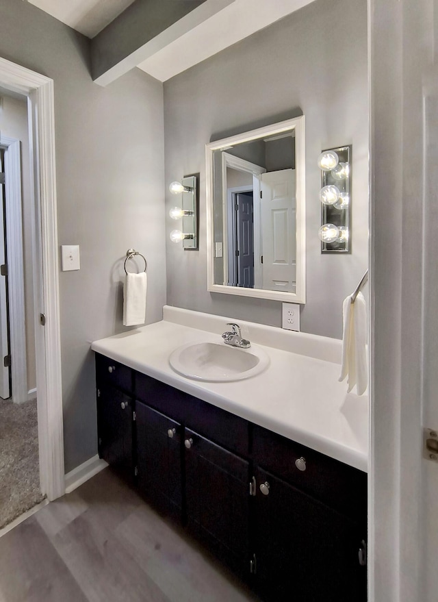 bathroom featuring vanity and hardwood / wood-style floors