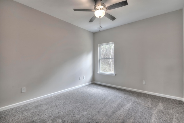 empty room featuring ceiling fan and carpet floors