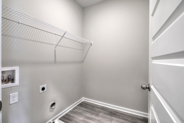 clothes washing area featuring hookup for a washing machine, hardwood / wood-style flooring, and electric dryer hookup