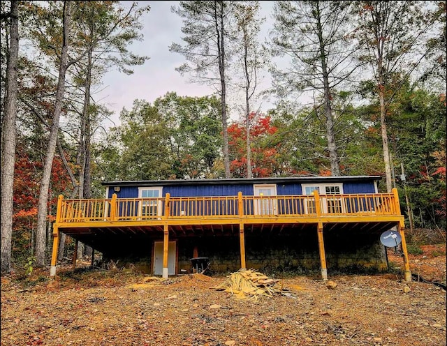 back of house featuring a deck