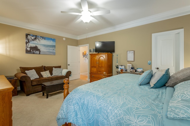 bedroom with ornamental molding, ceiling fan, and carpet