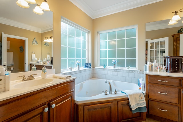 bathroom featuring crown molding, vanity, and a washtub